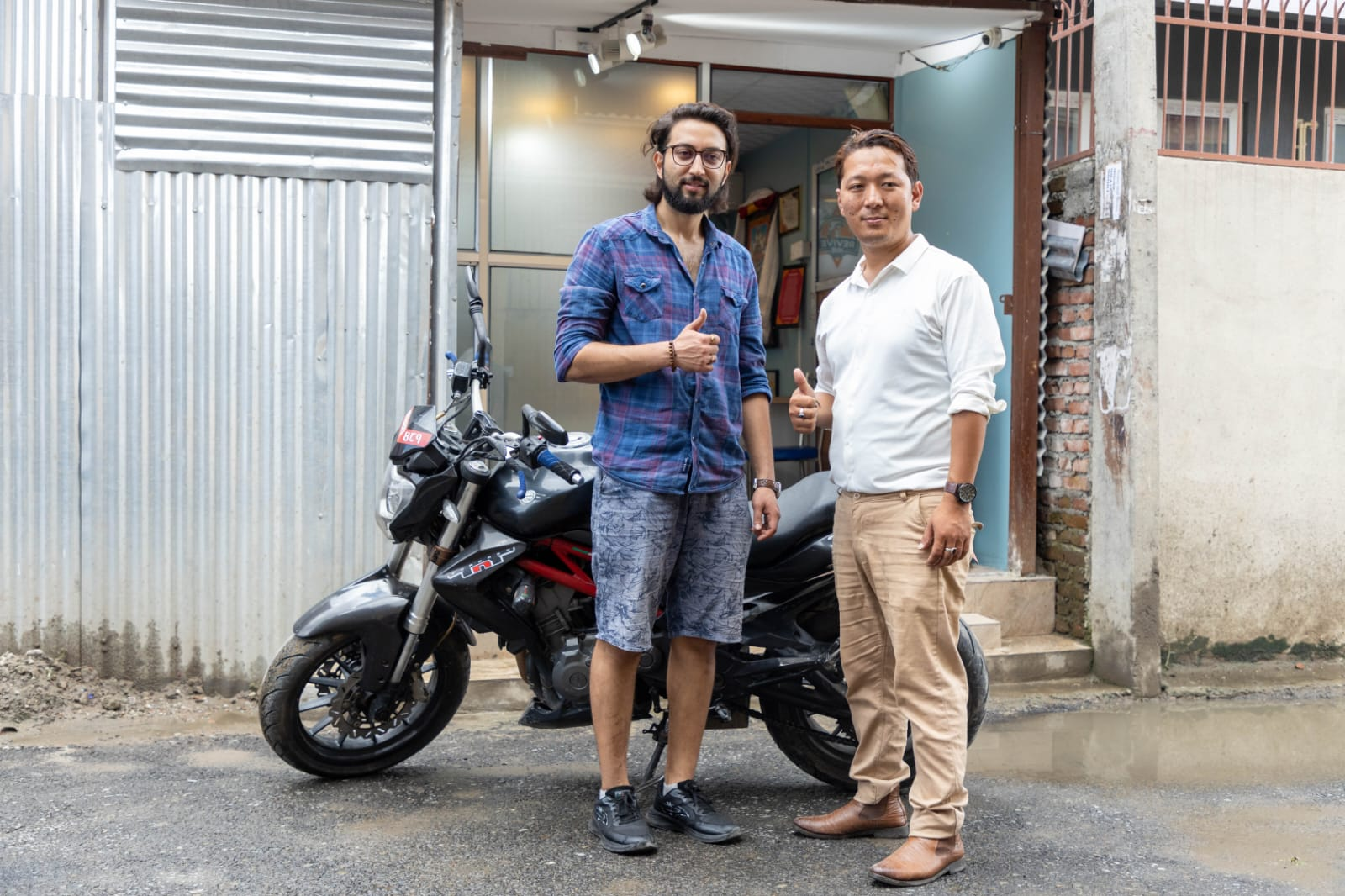 Auto mechanic performing car servicing under vehicle